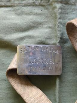 (FD)LOT OF 2 ITEMS, WWII AMERICAN RED CROSS APRON, AND USNCB OKINAWA BELT BUCKLE INSCRIBED TO ELTON