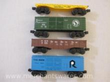 Four Lionel O Gauge Train Cars including UP 9020 Flat Car, NKP9031 Gondola, Great Northern 9339 Box