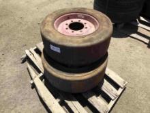 (2) Solid Skid Steer Tires & 8-Lug Rims.