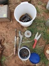 assorted tools and container of roofing nails