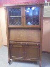 Antique Oak Drop Front Secretary w/ Leaded Glass Doors on Top/2 Drawers & Door on Bottom