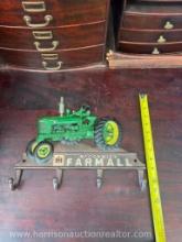 Cast-iron McCormick tractor hanger