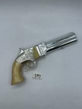 White revolver Avon bottle