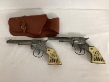 Two Vintage Daisy Toy Cap Guns with Holster