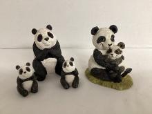 Four Panda Figures