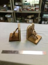 pair of bookends with ship wheel attached