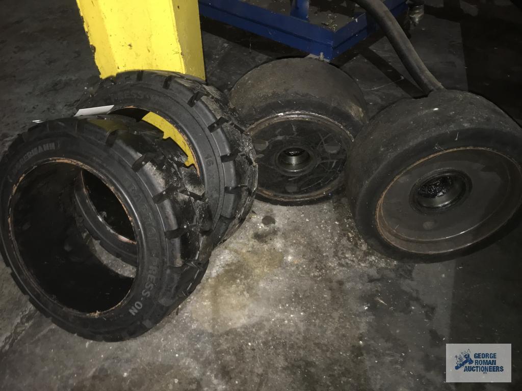 (2) NEW AND (2) USED FORKLIFT WHEELS