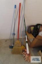 Variety of mops and brooms