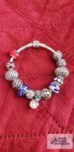Pandora bracelet with 13 charms 78.5 G (Description provided by seller)