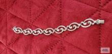 Silver colored bracelet marked Sterling 11.3 G (Description provided by seller)