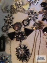 Black, gold and rhinestone costume jewelry.