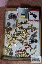 Assorted costume jewelry, including brooches and earrings