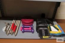 Assorted exercise items including free weights