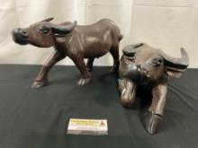 Pair of Handcarved African Water Buffalo Wooden Carvings w/ stippled hair marks all over the pieces