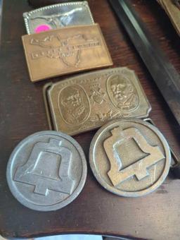 (FD) LOT OF 5 BELT BUCKLES. TIFFANY AND CO WELLS FARGO CO, HIT LINE USA, BULL, AND THE GETTY CENTER