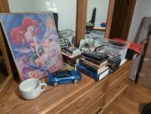 (BR2) LARGE LOT TO INCLUDE: ASSORTMENT OF CDS, LITTLE MERMAID FRAMED POSTER, LARGE WHITE CERAMIC