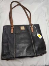 Vintage Black Dooney and Bourke Bag. Measures approx. 4 x 12 x 10.