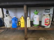 CONTENTS OF BOTTOM TABLE SHELF: PEST SPRAY CONTAINERS SUPPORT EQUIPMENT