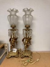 pair of gild brass cherub Putti Lamps with ruffled glass shades