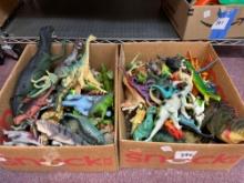 Two boxes of toy dinosaurs