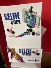 4 boxes of selfie sticks