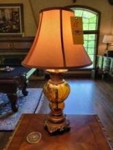 Pair of amber glass lamps with carved wood bases